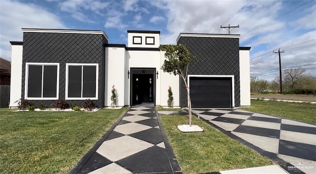 1505 W Kennedy Ave, Alton, TX 78573 - contemporary house featuring a front yard, stucco siding, concrete driveway, and a garage
