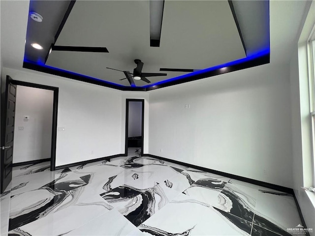 1505 W Kennedy Ave, Alton, TX 78573 - cinema room with a raised ceiling, ceiling fan, baseboards, and marble finish floors