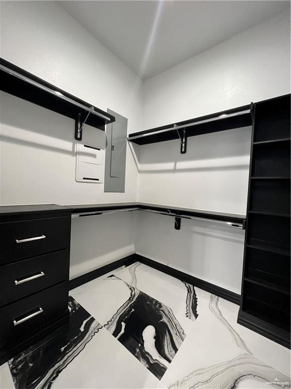 1505 W Kennedy Ave, Alton, TX 78573 - spacious closet with electric panel and marble finish floors
