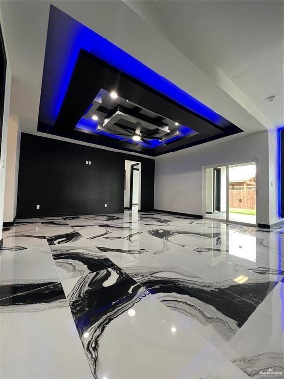1505 W Kennedy Ave, Alton, TX 78573 - home theater room featuring a raised ceiling and marble tiled flooring