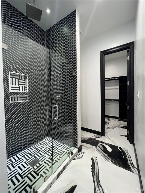 1505 W Kennedy Ave, Alton, TX 78573 - bathroom with a shower stall, marble tiled flooring, baseboards, and recessed lighting