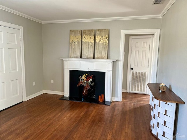 unfurnished living room with dark wood-type flooring and ornamental molding