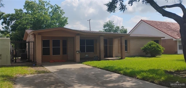 2008 Harvey St, Mcallen, TX 78501 - ranch-style house featuring a front lawn and brick siding