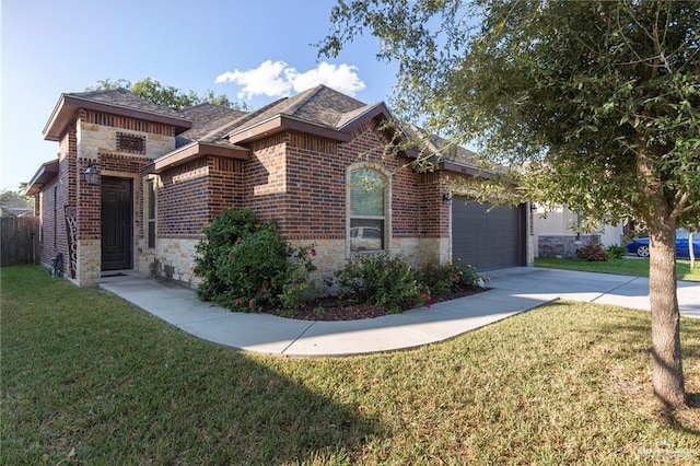 view of front of home featuring a garage and a front yard