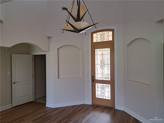 foyer featuring dark wood-type flooring