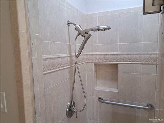 bathroom with a tile shower