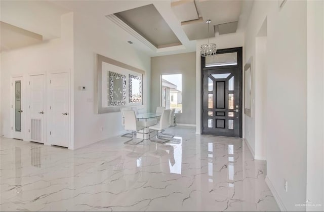 entrance foyer with an inviting chandelier