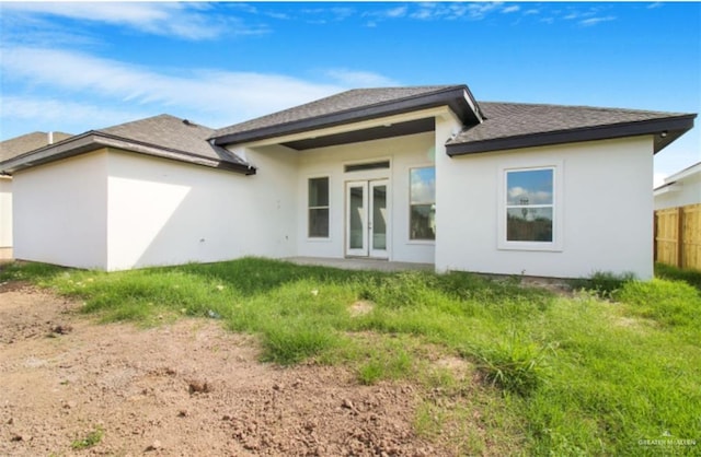 back of property featuring french doors