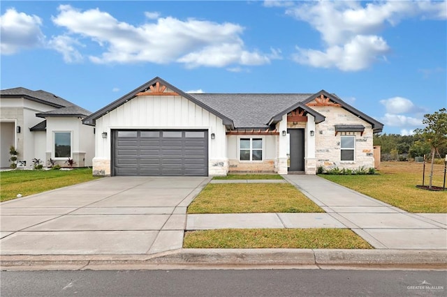 view of front of house with a front lawn and a garage