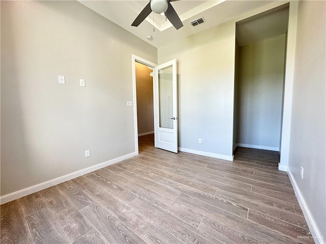 unfurnished bedroom featuring ceiling fan and light wood-type flooring