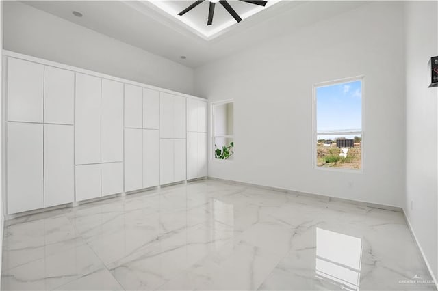 interior space featuring ceiling fan