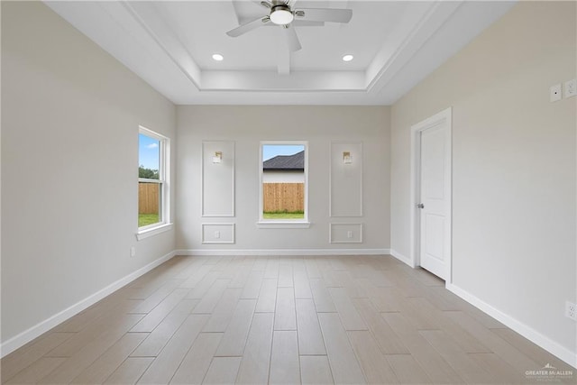 9110 N 25th St, Mcallen, TX 78504 - spare room featuring a raised ceiling, ceiling fan, wood finished floors, baseboards, and recessed lighting