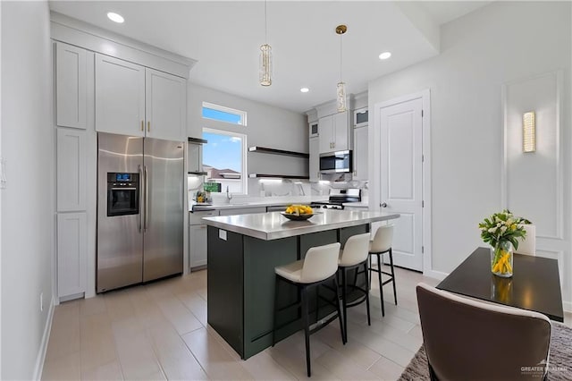 9110 N 25th St, Mcallen, TX 78504 - kitchen featuring stainless steel appliances, a sink, a kitchen bar, open shelves, and light countertops