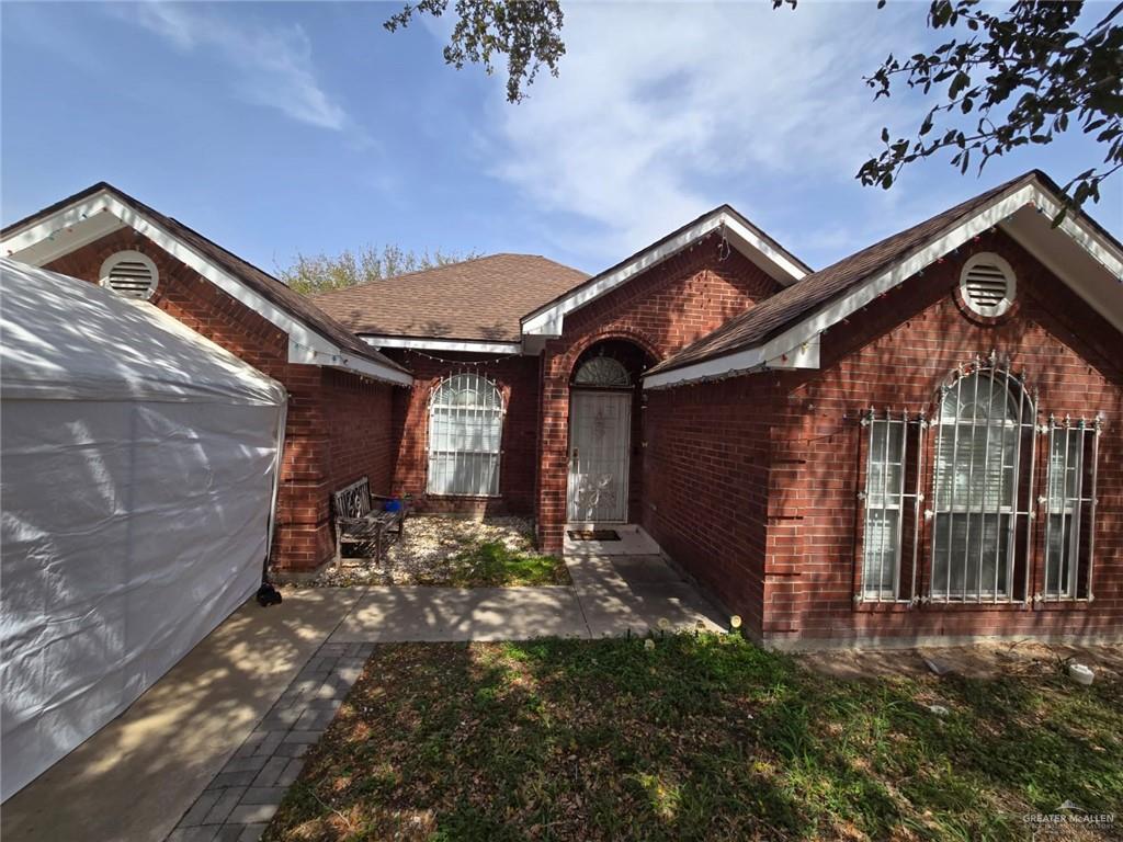 view of home's exterior with brick siding