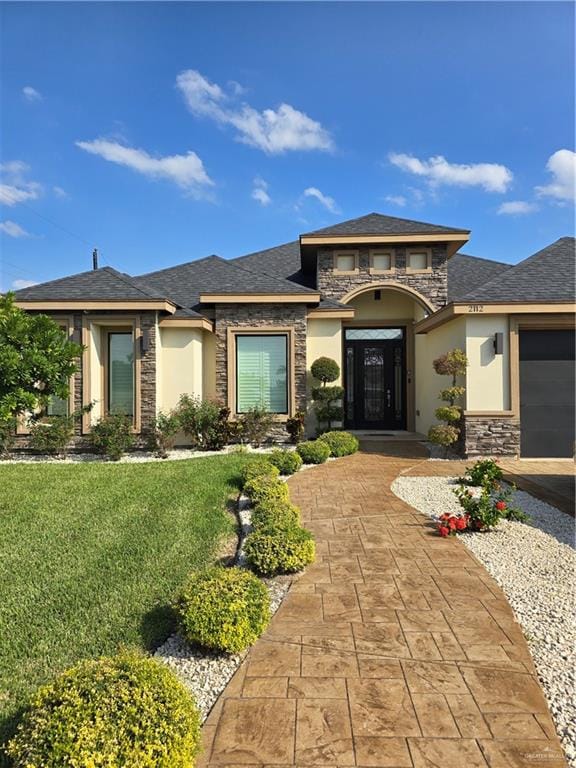 prairie-style house featuring a front yard