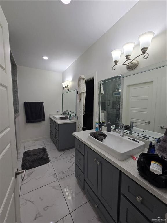 bathroom with walk in shower and vanity