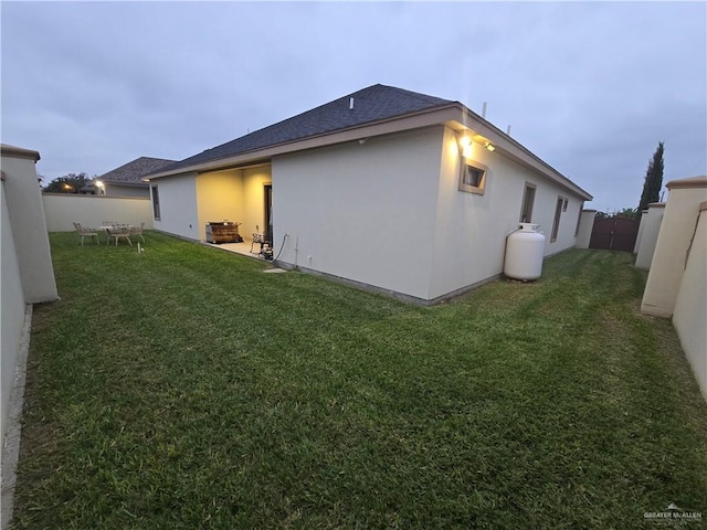 view of home's exterior with a yard