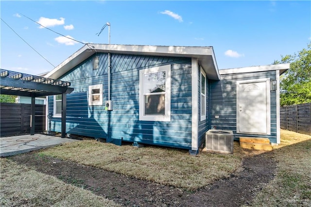 710 N Dahlia St, Pharr, TX 78577 - view of side of property featuring a pergola, central AC unit, and a patio