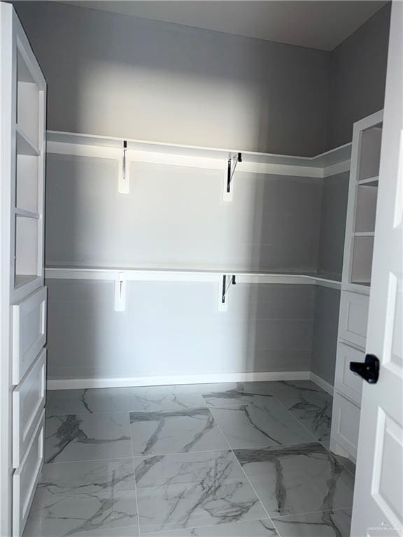 532 Demi St, Edinburg, TX 78542 - spacious closet featuring marble look tile flooring