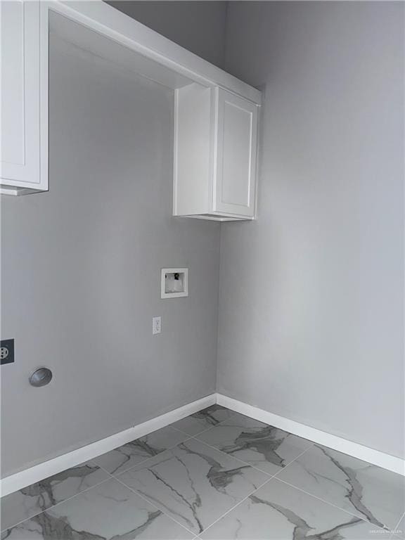 532 Demi St, Edinburg, TX 78542 - laundry area featuring baseboards, marble look tile flooring, and cabinet space
