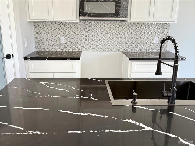 532 Demi St, Edinburg, TX 78542 - kitchen featuring a sink, white cabinetry, and tasteful backsplash