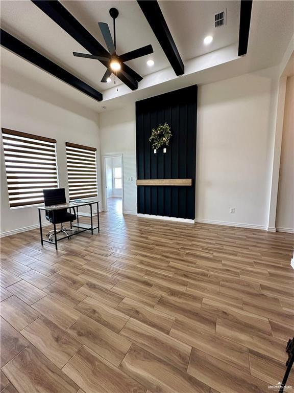 2413 N Woody St, Edinburg, TX 78541 - living area with light wood-style floors, a ceiling fan, beam ceiling, and baseboards