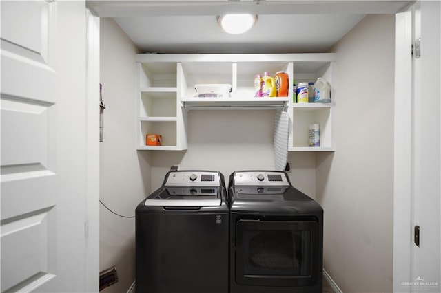 laundry room with laundry area and washer and clothes dryer