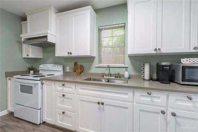 kitchen with white range with electric cooktop, light hardwood / wood-style floors, white cabinets, and sink