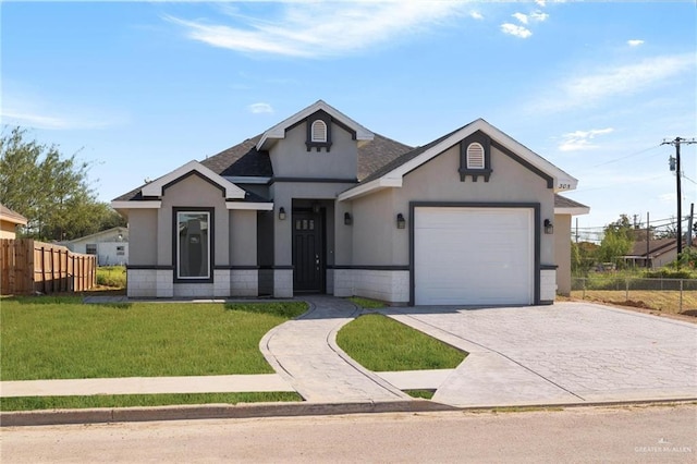 view of front facade featuring a front yard and a garage