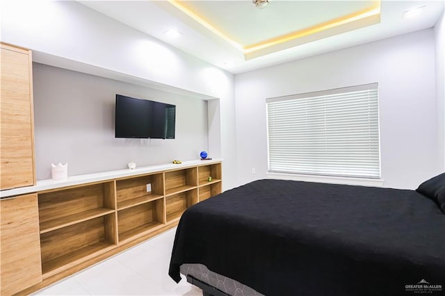 bedroom with a tray ceiling