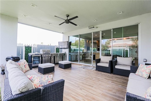 deck featuring outdoor lounge area and a grill