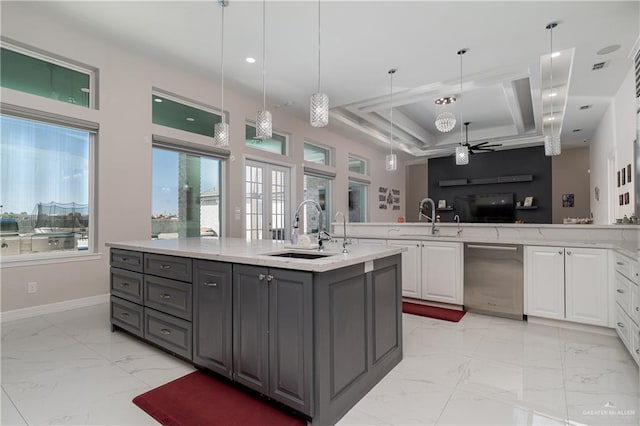 kitchen featuring hanging light fixtures, white cabinetry, sink, and gray cabinets