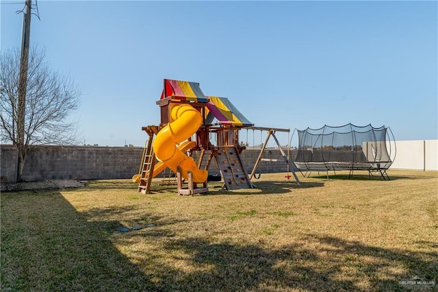 view of playground featuring a yard and a trampoline