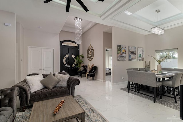 living room featuring coffered ceiling and a high ceiling