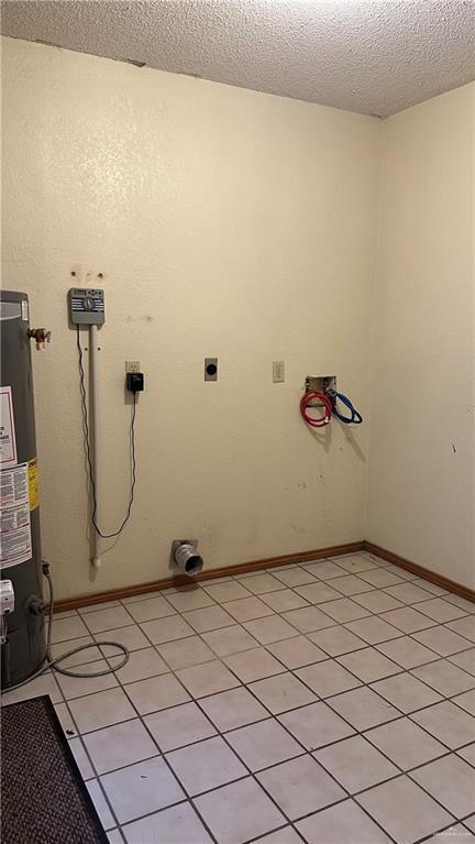 laundry room featuring laundry area, baseboards, a textured ceiling, hookup for an electric dryer, and gas water heater