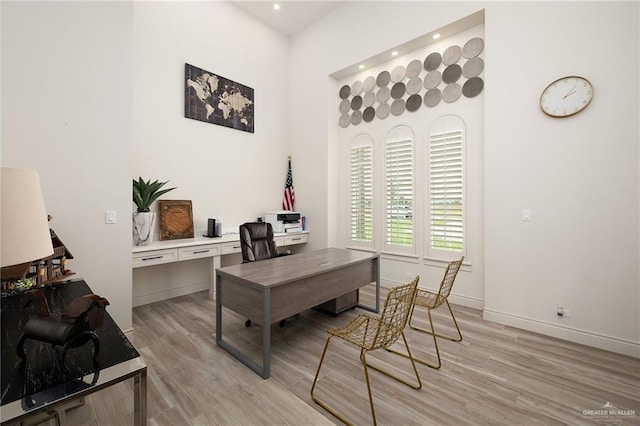 office with light wood-style floors, recessed lighting, and baseboards