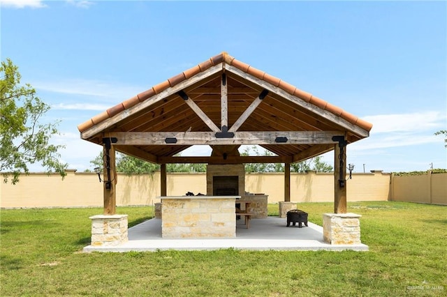 view of home's community featuring a yard, a gazebo, and a fenced backyard
