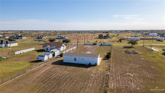 birds eye view of property featuring a rural view