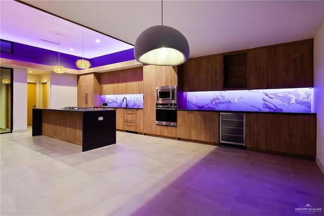 kitchen with tasteful backsplash, wine cooler, decorative light fixtures, and appliances with stainless steel finishes