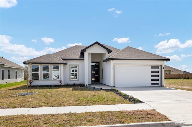 1508 Isabella Grace St, Weslaco, TX 78599 - view of front of property with an attached garage, a shingled roof, stucco siding, a front yard, and driveway
