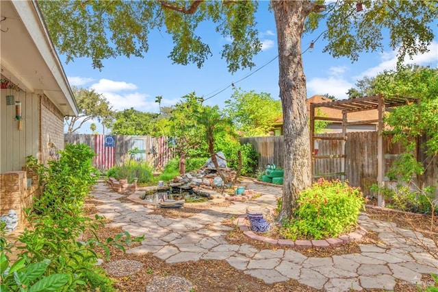 view of yard featuring a pergola and a patio