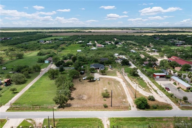 birds eye view of property featuring a rural view