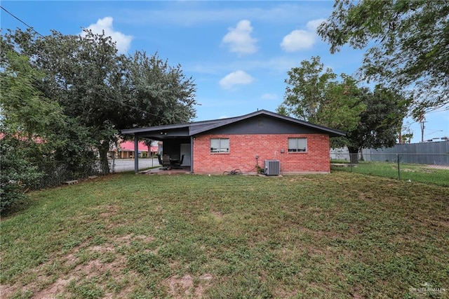 117 W Hawk Ave, Pharr, TX 78577 - back of property featuring brick siding and a carport