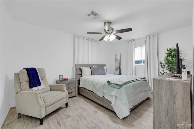 117 W Hawk Ave, Pharr, TX 78577 - bedroom featuring a ceiling fan and light wood-style flooring
