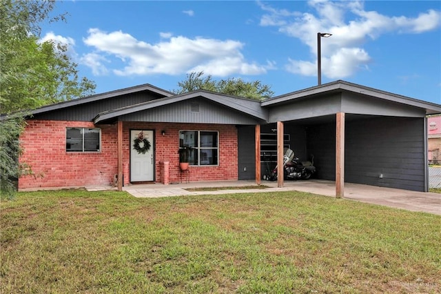 117 W Hawk Ave, Pharr, TX 78577 - ranch-style house featuring brick siding, a front lawn, concrete driveway, and an attached carport