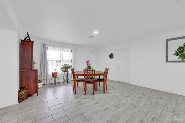 117 W Hawk Ave, Pharr, TX 78577 - dining room featuring light wood-style flooring and recessed lighting