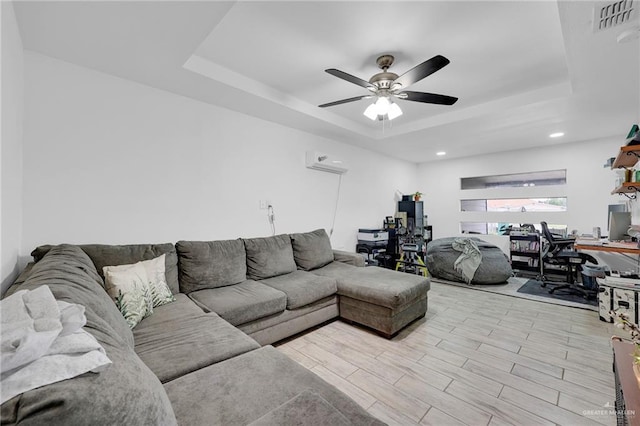 117 W Hawk Ave, Pharr, TX 78577 - living room with a desk, a raised ceiling, an AC wall unit, a ceiling fan, and recessed lighting