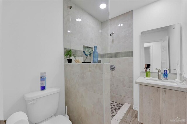117 W Hawk Ave, Pharr, TX 78577 - full bathroom featuring a walk in shower, vanity, and wood finished floors