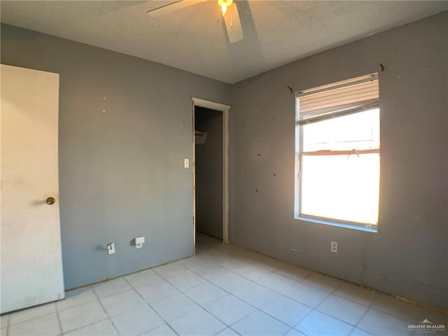 3823 Seles Dr, Weslaco, TX 78599 - empty room with ceiling fan and a textured ceiling