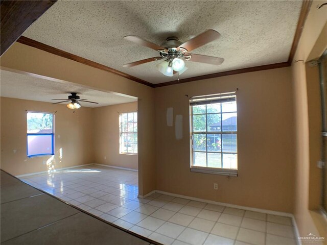 3823 Seles Dr, Weslaco, TX 78599 - tiled empty room featuring ceiling fan, crown molding, and a textured ceiling